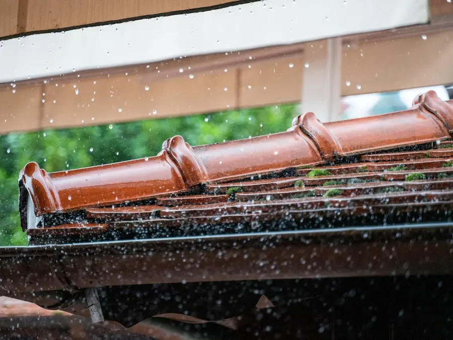 Rainwater flowing from a roof edge during a storm, highlighting the importance of proper roof drainage.